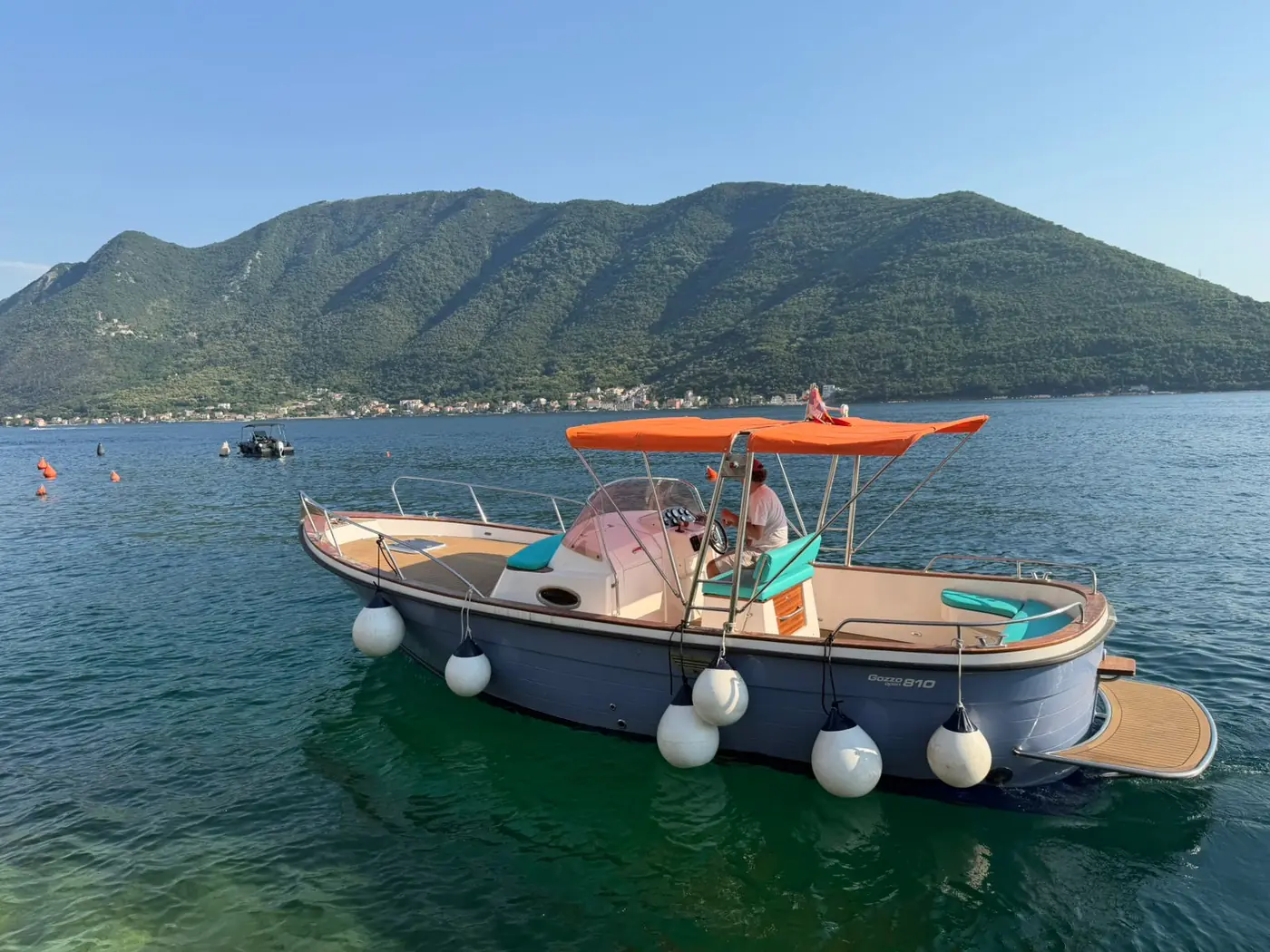 Rosmarino Boat with teak deck and turquoise cushions